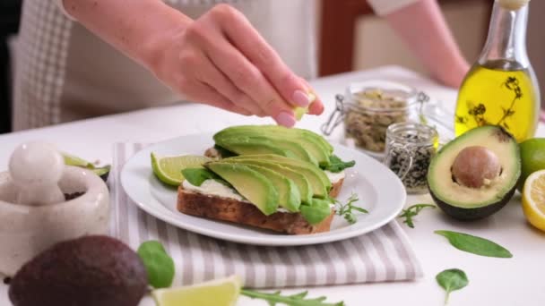 Woman Prepares Healthy Breakfast Snack Soft Cheese Sandwich Avocado — Vídeo de stock