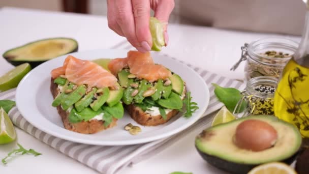 Healthy Breakfast Snack Making Soft Cheese Avocado Salmon Sandwich — Stock video