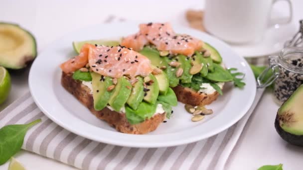 Healthy Breakfast Snack Making Soft Cheese Avocado Salmon Sandwich — Vídeos de Stock