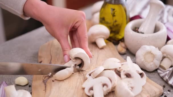 Woman Cuts Champignon Mushrooms Knife Wooden Cutting Board — Vídeo de stock