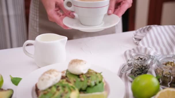 Healthy Breakfast Woman Puts Cup Coffee Table Poached Egg Soft — Stock video