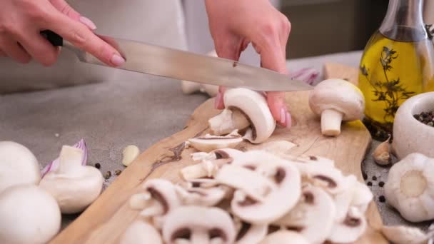 Woman Cuts Champignon Mushrooms Knife Wooden Cutting Board — Stockvideo