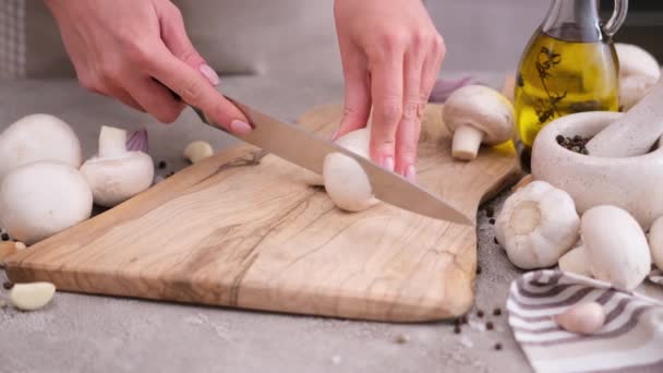 Woman Cuts Champignon Mushrooms Knife Wooden Cutting Board — ストック動画