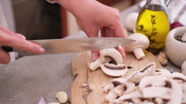 Woman Cuts Champignon Mushrooms Knife Wooden Cutting Board — Stockvideo