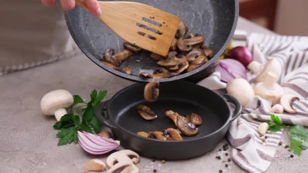 Woman Pouring Fried Champignon Mushrooms Frying Pan Ceramic Plate — Stok video