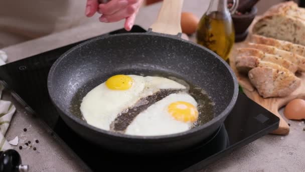 Woman Adding Pepper Fried Eggs Non Stick Pan Stove — Video