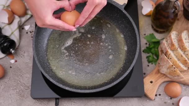 Woman Breaks Egg Hot Frying Pan Stove — Stock video