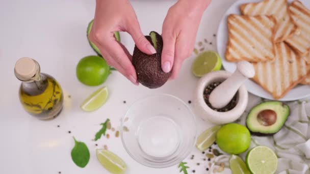 Close Hands Woman Halving Avocado Domestic Kitchen — Stock Video