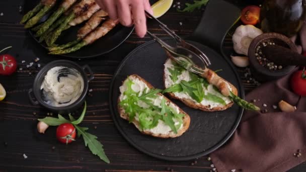 Asparagus Wrapped Bacon Cream Cheese Sandwiches Black Ceramic Serving Plate — Stock Video
