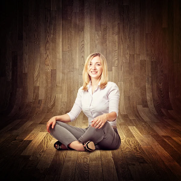 Sit woman on wood floor — Stock Photo, Image