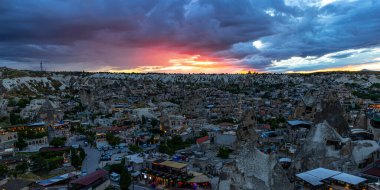 GOREME/TURKEY - June 26, 2022: panoramic view of the city of goreme at sunset.