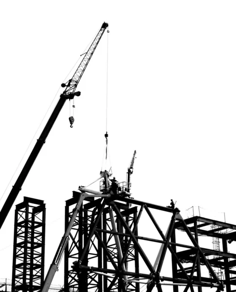 Site de construction avec grue et travailleurs — Photo