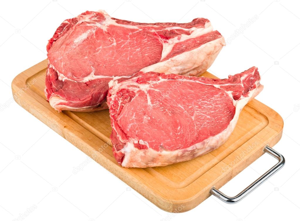 raw meat on wood board