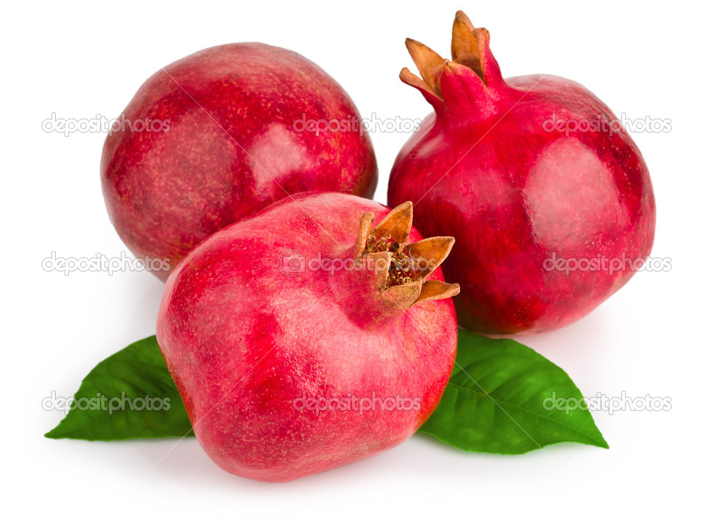 Juicy pomegranate with leaves