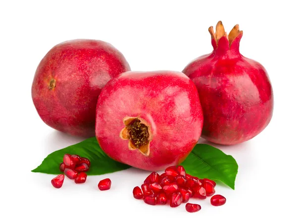 Ripe pomegranates with leaves isolated — Stock Photo, Image