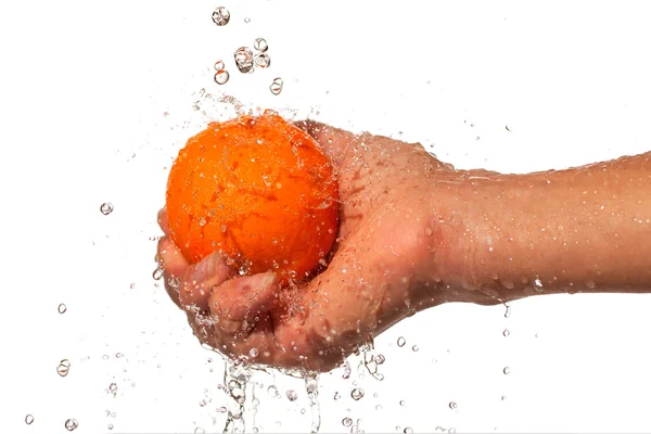 Oranje in hand. — Stockfoto