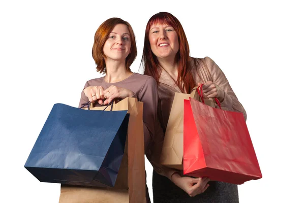 Young womans after shopping. Royalty Free Stock Photos