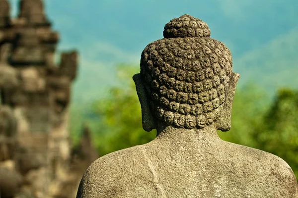 Imagen apedreada de Buddha en Borobudur, Indonesia — Foto de Stock