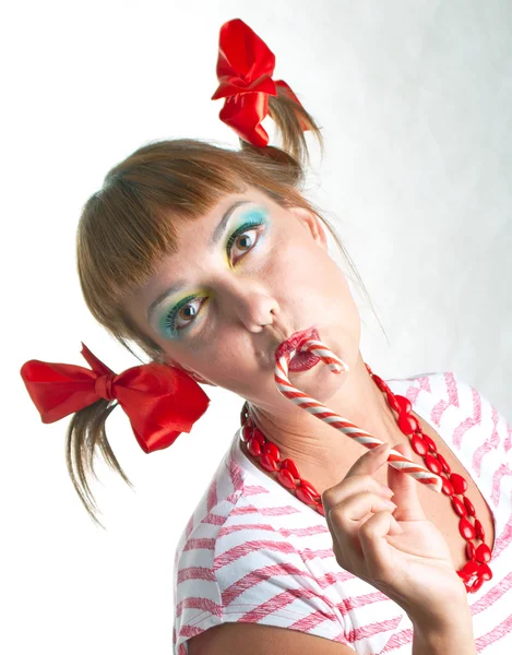 Menina com doces listrados — Fotografia de Stock