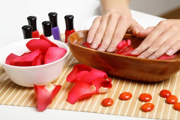 Woman is getting manicure — Stock Photo, Image