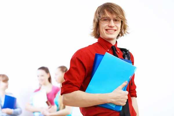 Student im roten Hemd mit Büchern — Stockfoto