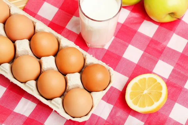 Milk in a glass jar and eggs Royalty Free Stock Images