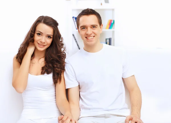 Young happy couple at hone together s — Stock Photo, Image