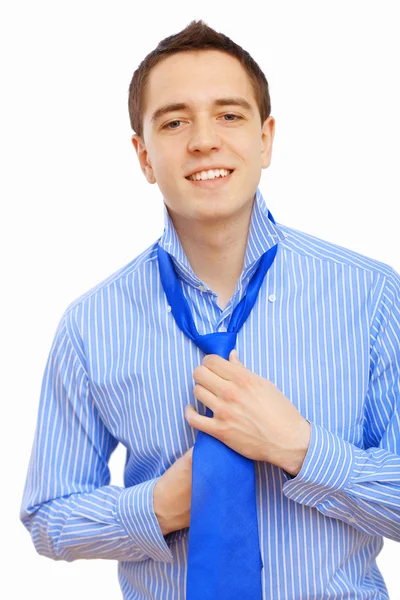 Businessman at home making his tie — Stock Photo, Image