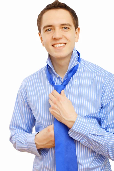 Businessman at home making his tie — Stock Photo, Image