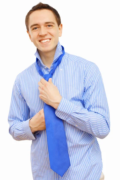 Businessman at home making his tie — Stock Photo, Image