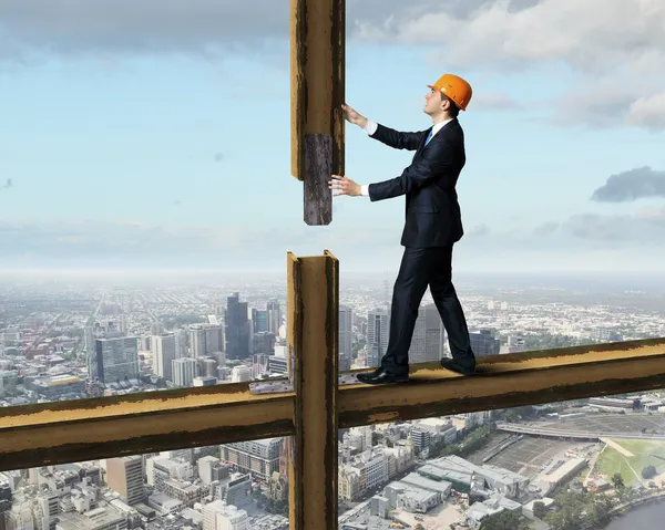 Businessman standing on the construction site — Stock Photo, Image