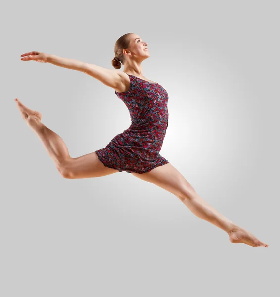 Girl in color dress dancing — Stock Photo, Image