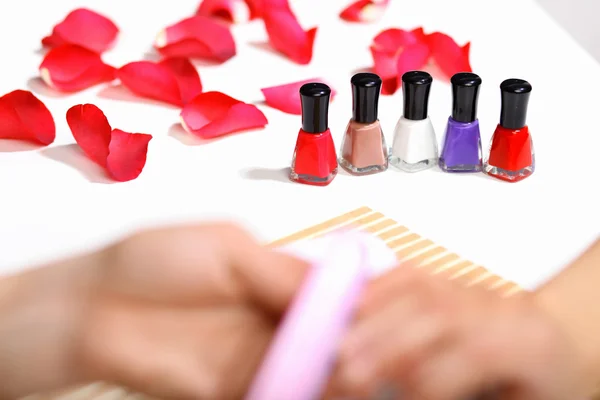 Woman is getting manicure — Stock Photo, Image