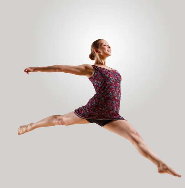 Girl in color dress dancing — Stock Photo, Image