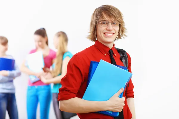 Student in red shirt with books — Stock Photo, Image