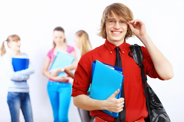 Student i röd tröja med böcker — Stockfoto