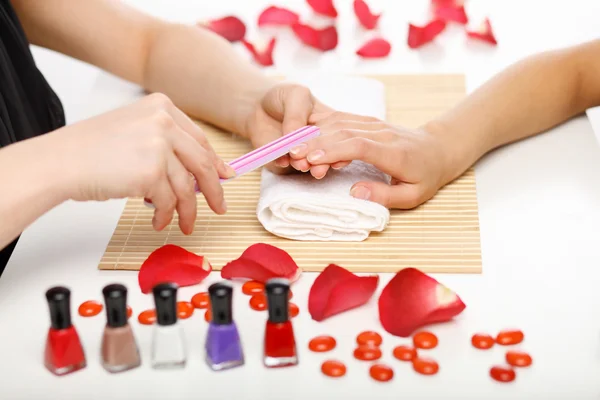 Woman is getting manicure — Stock Photo, Image