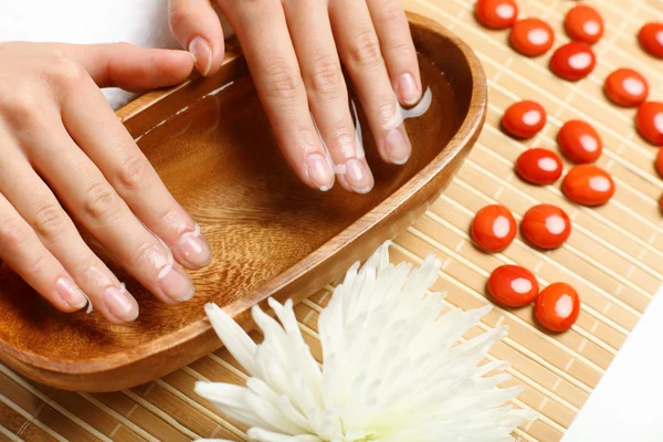 Woman is getting manicure — Stock Photo, Image