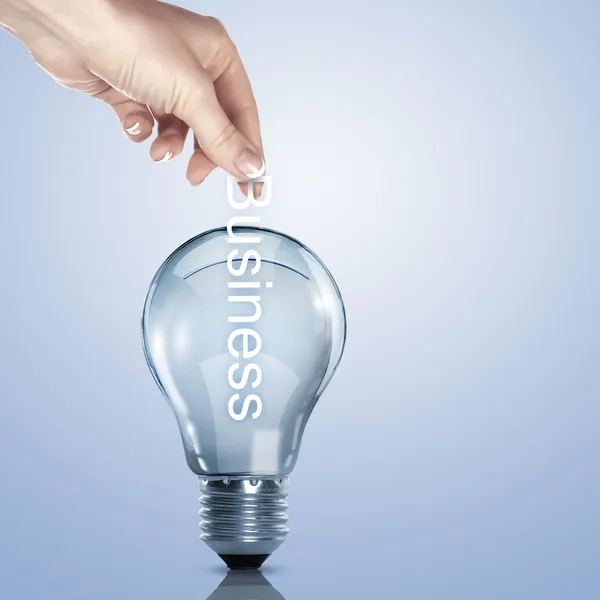 Business term and electric bulb — Stock Photo, Image