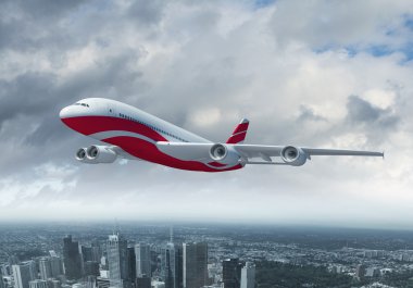 bir kent üzerinde uçan beyaz yolcu uçağı