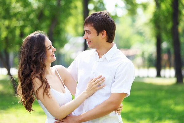 Young love Couple smiling under blue sky