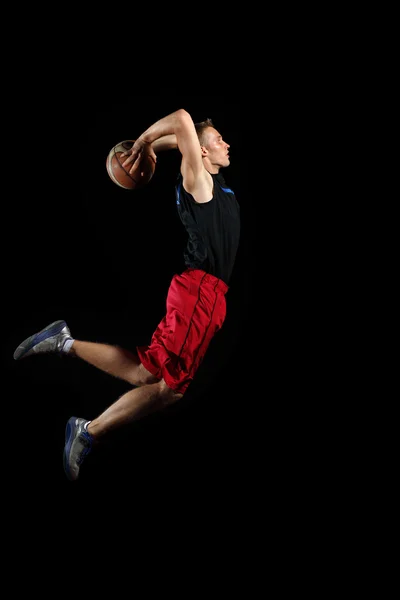 Basket spelare med en boll — Stockfoto