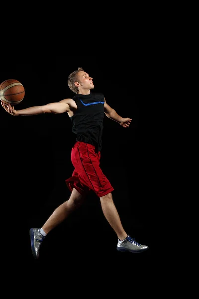 Basket spelare med en boll — Stockfoto