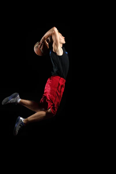 Basketbalista s míčem — Stock fotografie