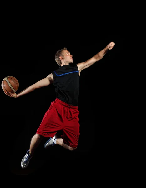 Basket spelare med en boll — Stockfoto