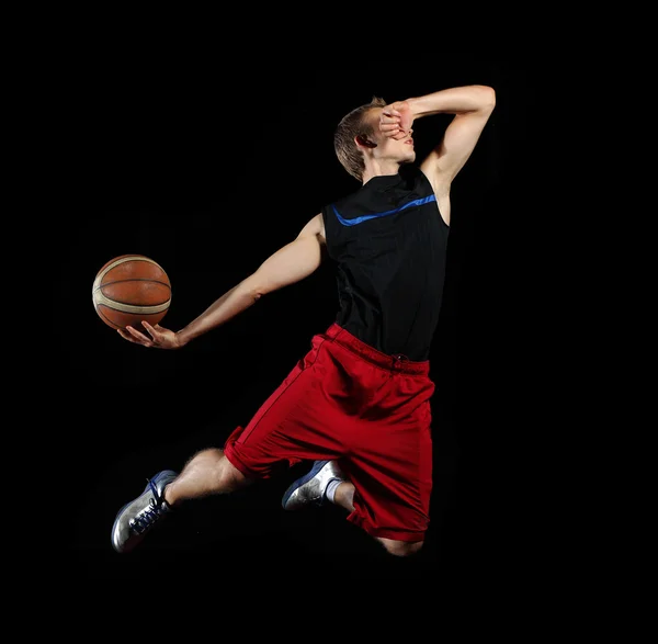 Basket spelare med en boll — Stockfoto