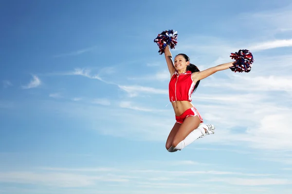 Młoda kobieta cheerleaderka — Zdjęcie stockowe