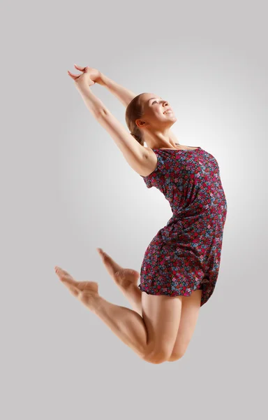 Girl in color dress dancing — Stock Photo, Image