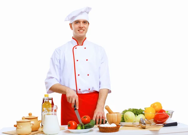 Young cook preparing food Royalty Free Stock Photos