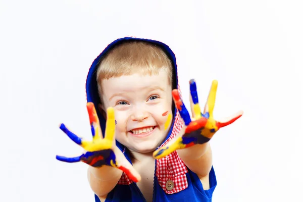 Boldog gyermek kezében festék — Stock Fotó